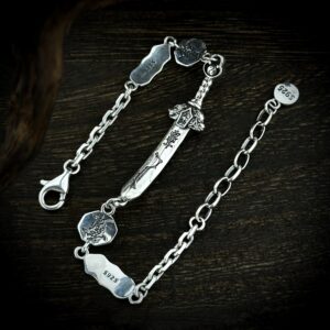 Detailed view of hand carved seven star sword silver bracelet, red cinnabar inlay Taoist symbolic charms vintage oriental craft